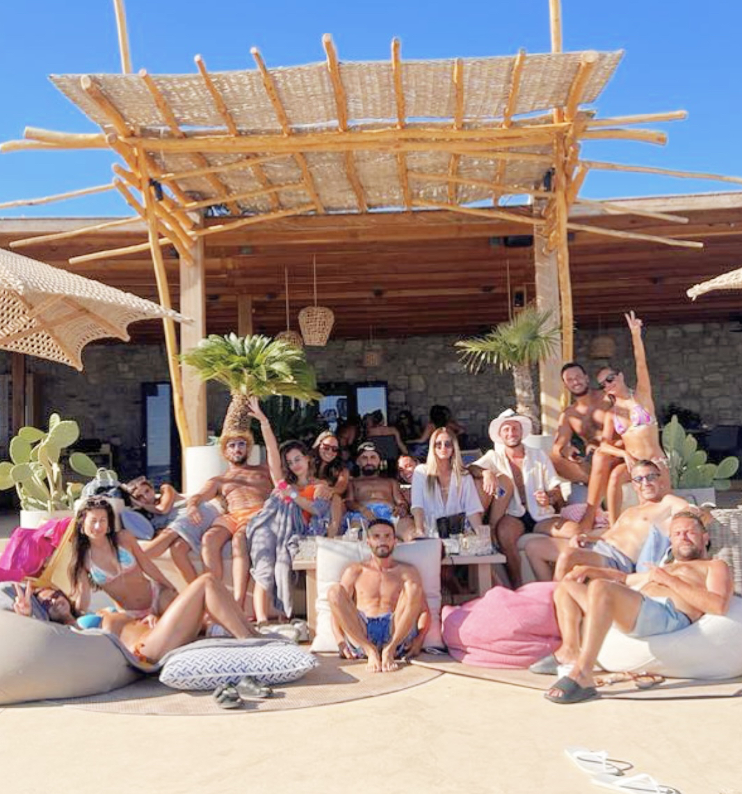 Friends gathered at a luxury beach club