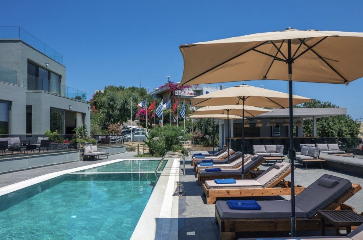 Greek island poolside with loungers and umbrellas