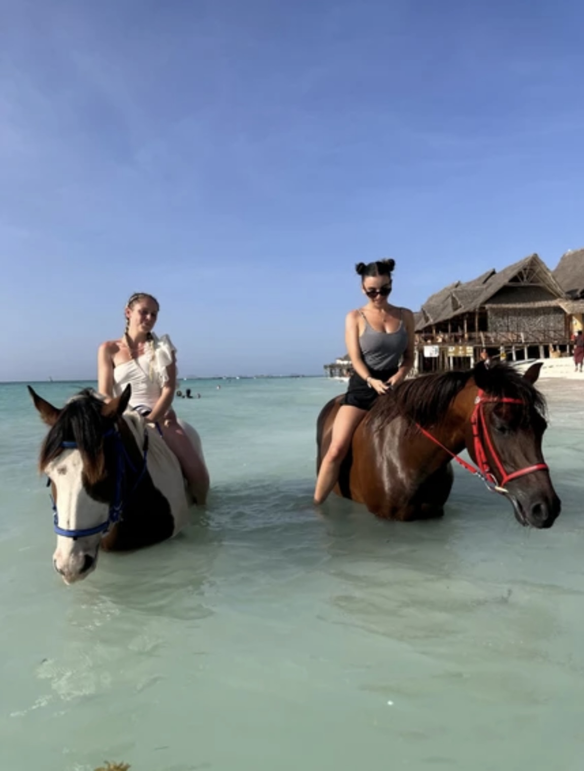 Horseback riding in turquoise waters
